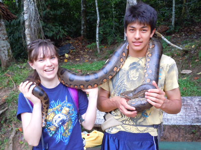 Luke Plowden & Amrit Moore with anaconda. © Photo by Campbell Plowden/Center for Amazon Community Ecology
